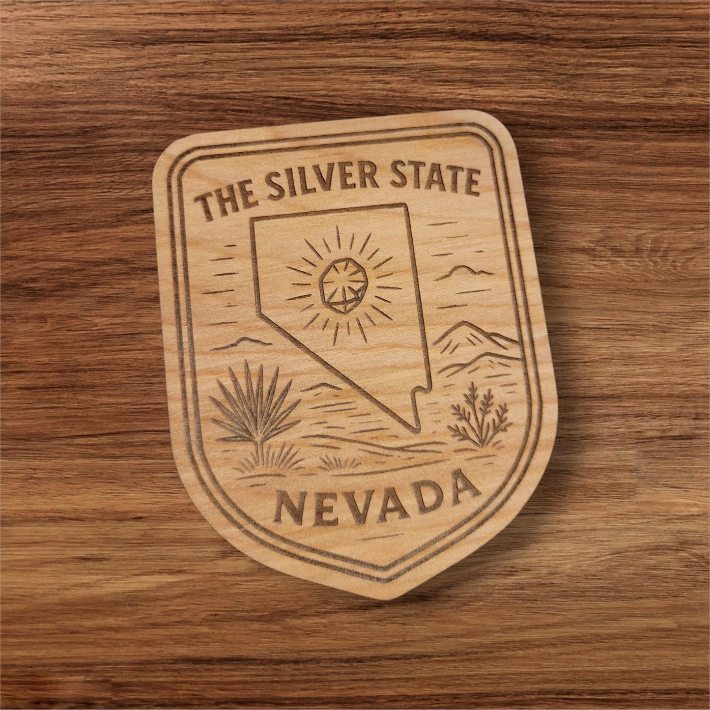 The Silver State Nevada Magnet – State Outline and Sunburst Badge
