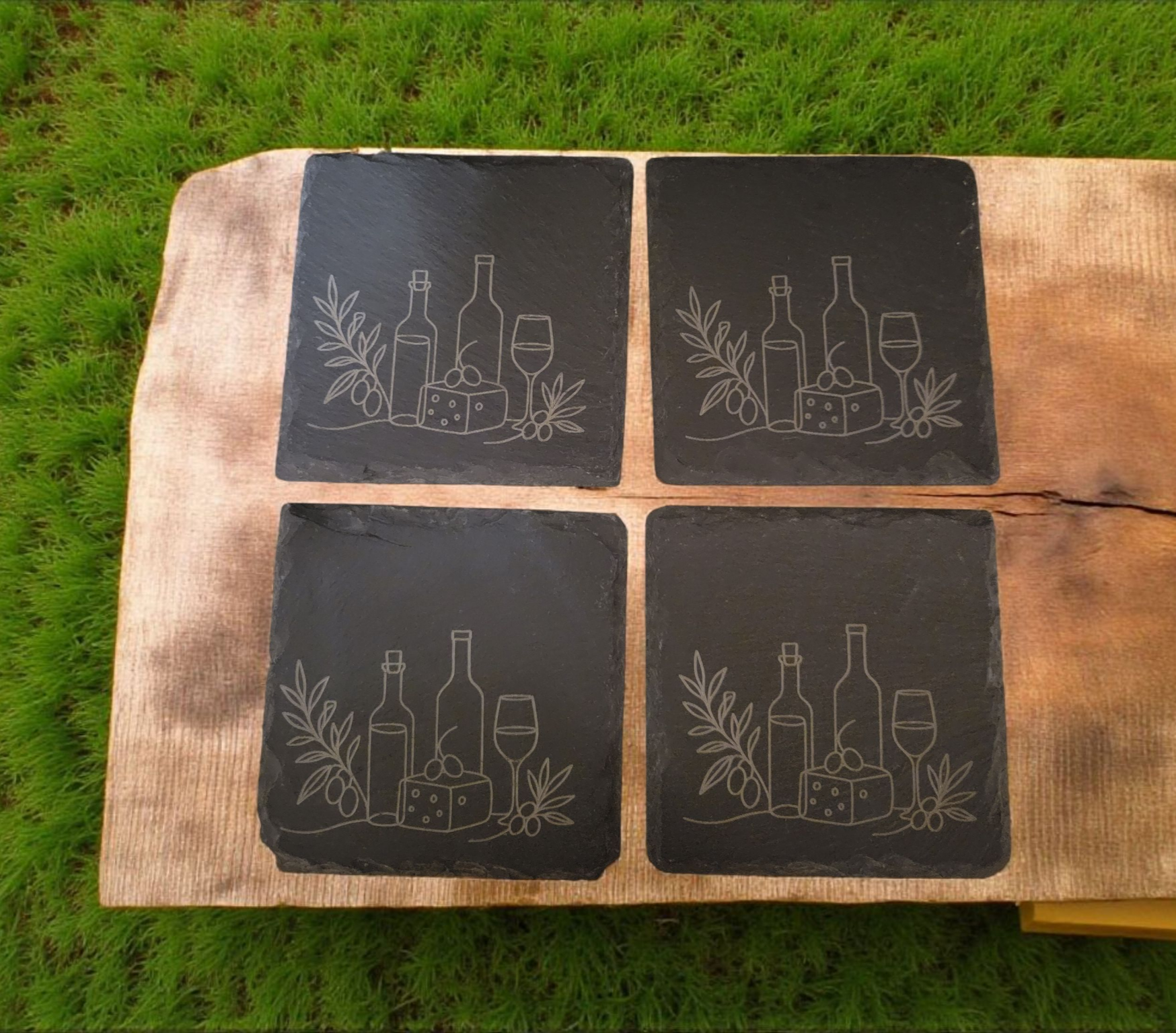 Rustic set of 4 square slate coasters, laser engraved with olive branch sprigs or a wine-and-cheese scene. Natural slate stone with etched line art design, perfect for protecting tables in style.
