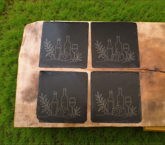 Rustic set of 4 square slate coasters, laser engraved with olive branch sprigs or a wine-and-cheese scene. Natural slate stone with etched line art design, perfect for protecting tables in style.