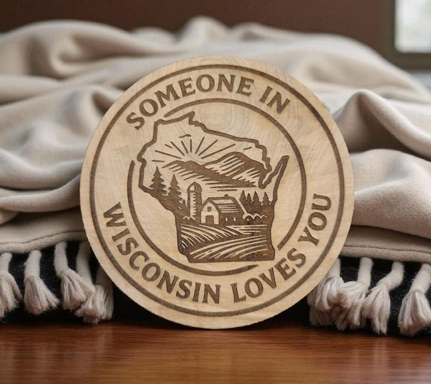 Engraved wood magnet in shape of Wisconsin with “Someone in Wisconsin Loves You” design.