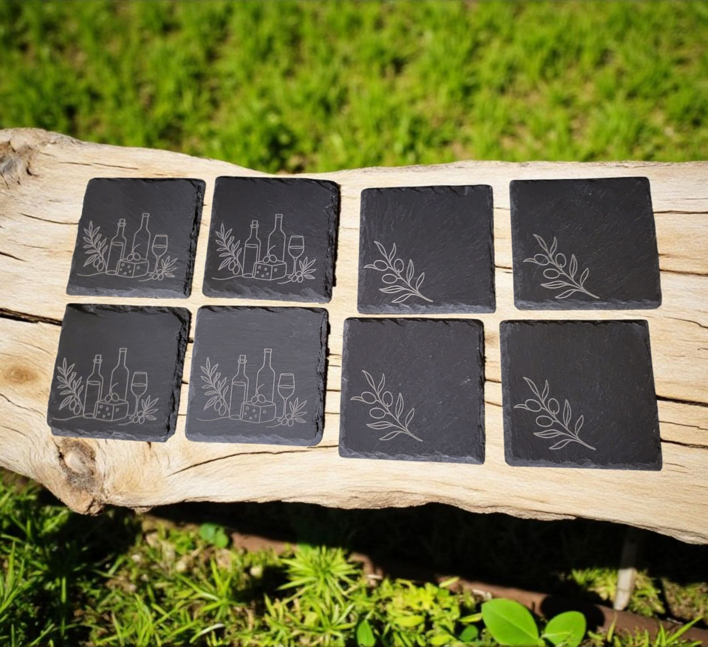 Rustic set of 4 square slate coasters, laser engraved with olive branch sprigs or a wine-and-cheese scene. Natural slate stone with etched line art design, perfect for protecting tables in style.
