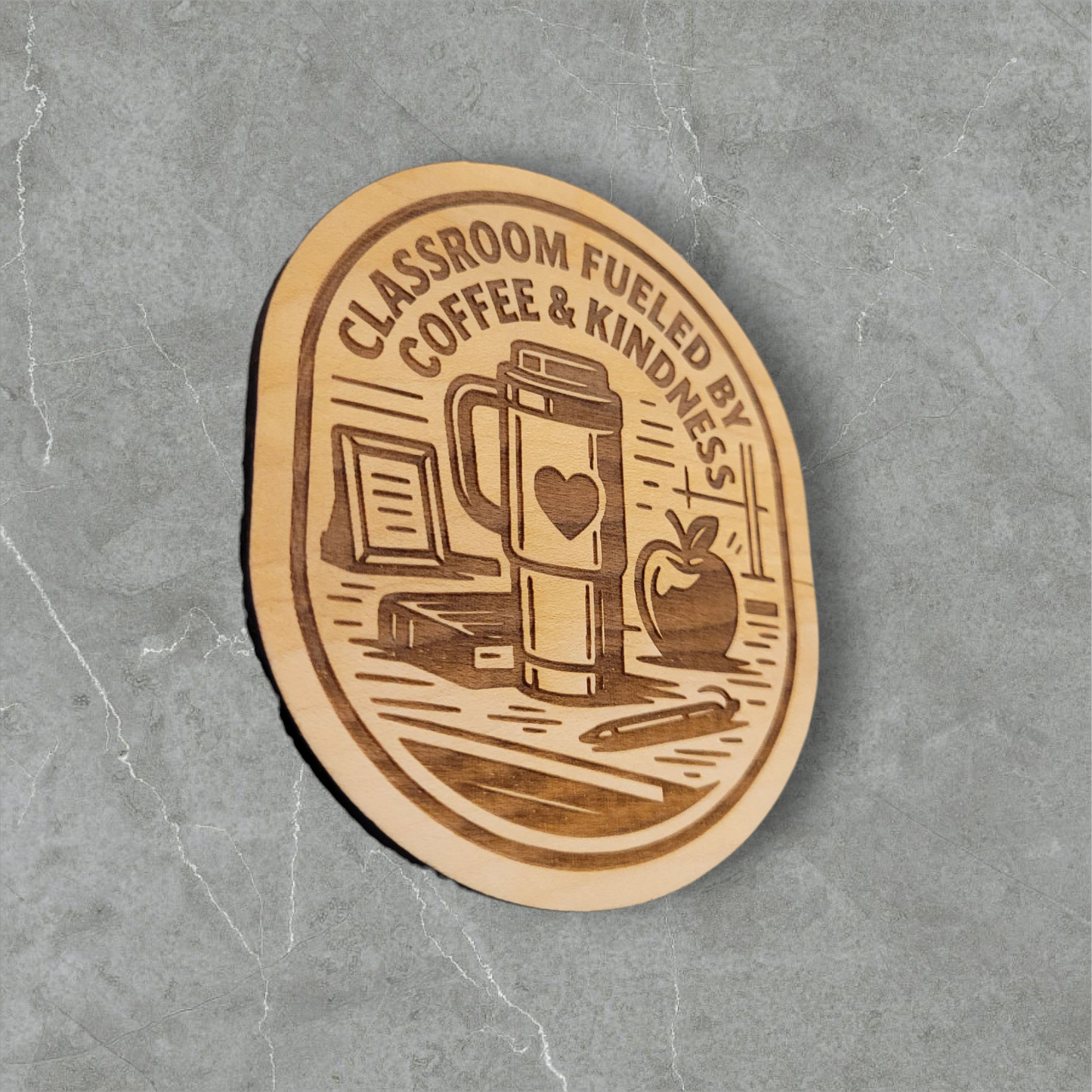 Wood magnet engraved with “Classroom Fueled by Coffee & Kindness,” featuring a coffee tumbler, books, apple, and classroom items