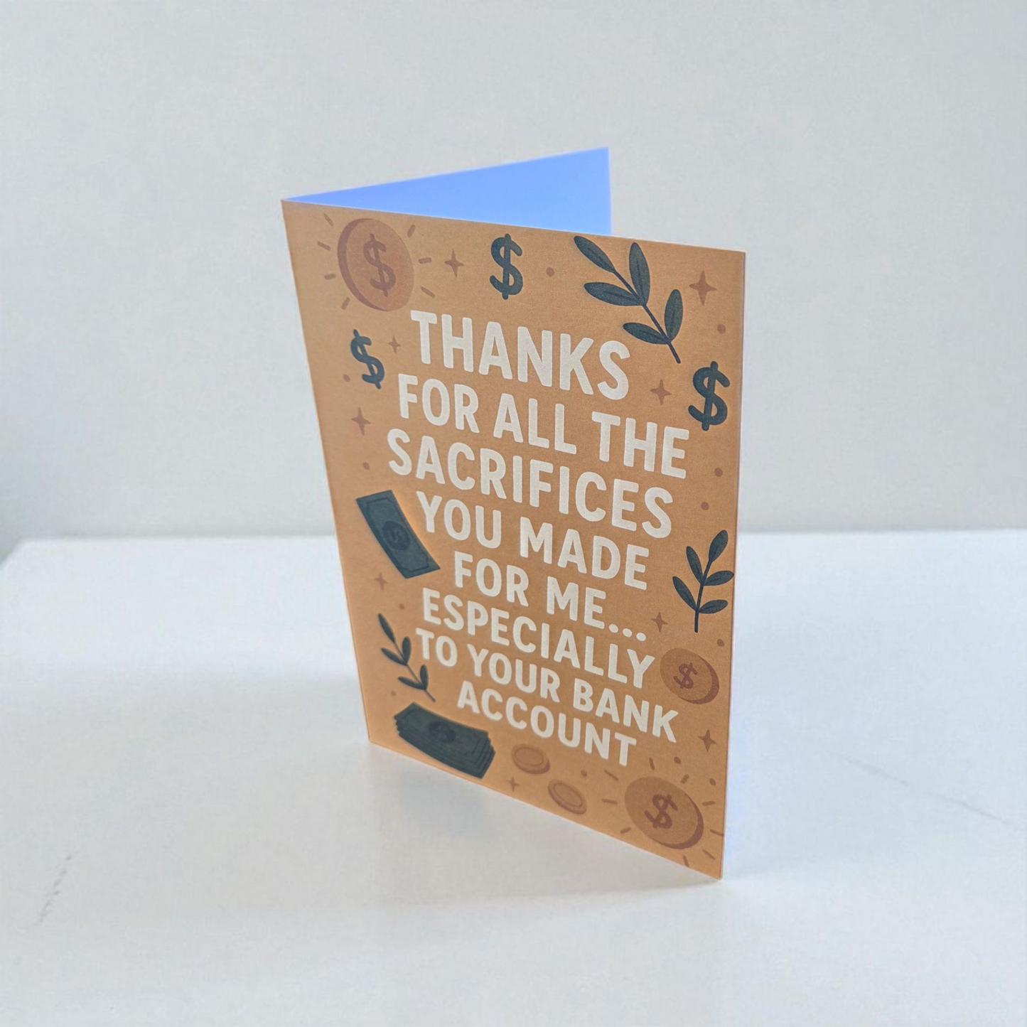Greeting card reading ‘Thanks for all the sacrifices you made for me especially to your bank account’ with money and dollar sign illustrations.