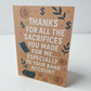 Greeting card reading ‘Thanks for all the sacrifices you made for me especially to your bank account’ with money and dollar sign illustrations.