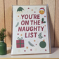 Greeting card reading ‘You’re on the Naughty List’ with Santa hat emoji, holly, ornaments, and stars.
