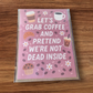 Greeting card reading ‘Let’s Grab Coffee and Pretend We’re Not Dead Inside’ with coffee and pastry illustrations.
