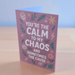 Greeting card reading ‘You’re the Calm to My Chaos and Sometimes the Cause’ on mauve background with floral and lightning illustrations.