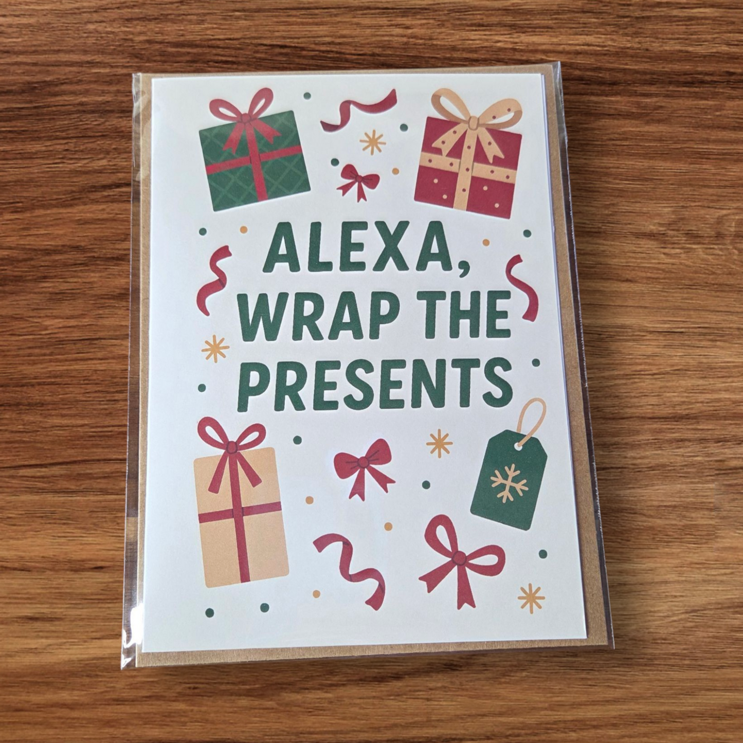 Funny Christmas greeting card reading ‘Alexa, Wrap the Presents’ surrounded by wrapped gift illustrations.