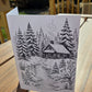 Winter cabin line-art card printed on watercolor paper, designed for painting or coloring.