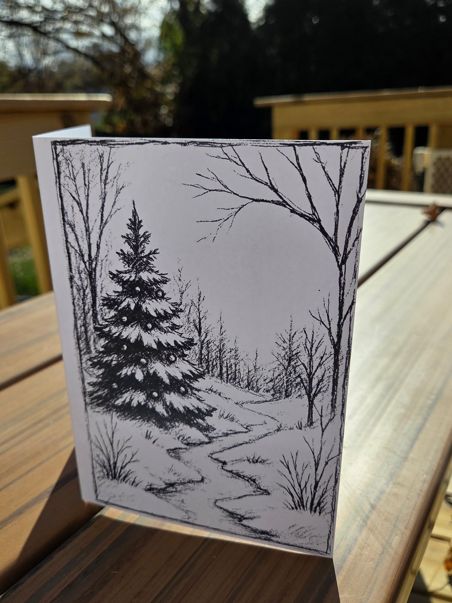 Winter cabin line-art card printed on watercolor paper, designed for painting or coloring.