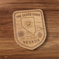 The Silver State Nevada Magnet – State Outline and Sunburst Badge