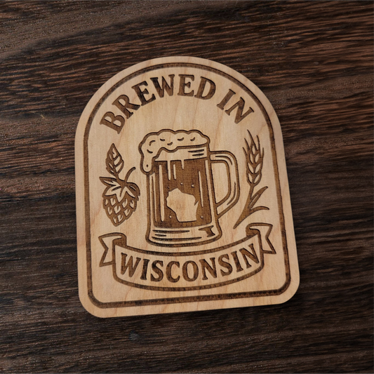 Laser-engraved wood magnet with beer mug, hops, and wheat, reading “Brewed in Wisconsin”