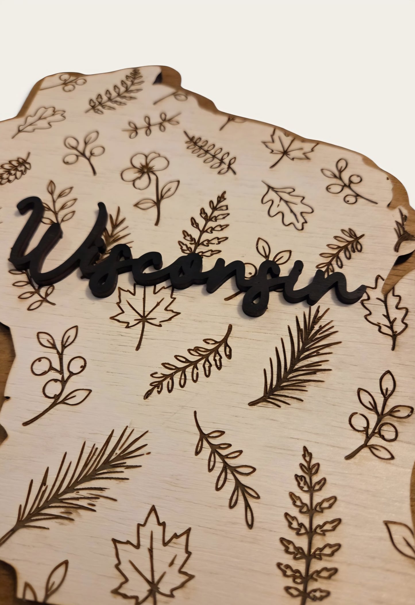 Wisconsin botanical two-layer wood sign with engraved leaves and raised Wisconsin lettering