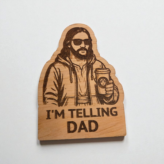 Engraved wood magnet of Jesus holding a drink that says I’m telling Dad