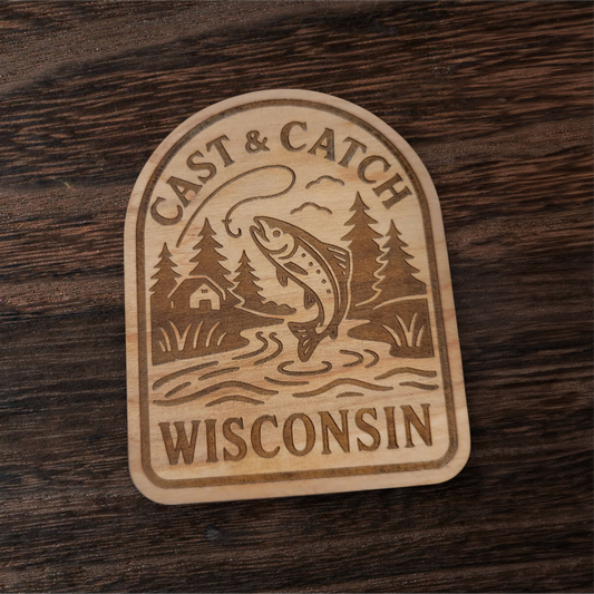 Laser engraved fishing magnet featuring a trout and cabin scene – Cast & Catch Wisconsin rustic wood design