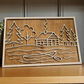 Layered wood sign featuring a rustic cabin, pine trees, and canoe scene — laser cut from multiple layers of natural wood, perfect for lake house or cabin decor.