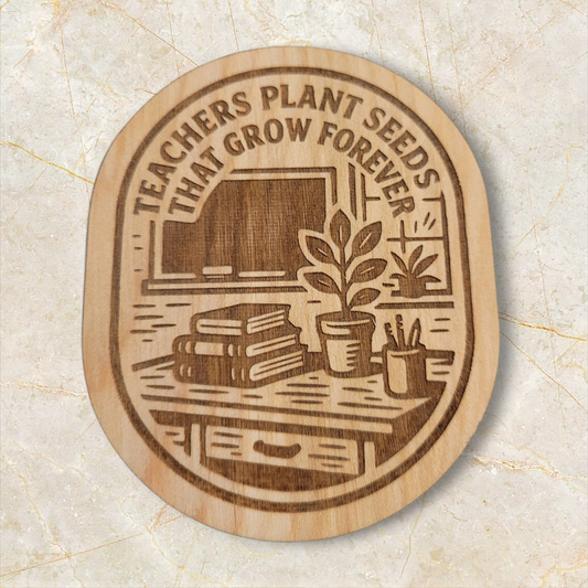 Engraved wood magnet featuring “Teachers Plant Seeds That Grow Forever” with classroom books, plant, and chalkboard illustration