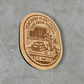 Engraved wood magnet featuring “Teachers Plant Seeds That Grow Forever” with classroom books, plant, and chalkboard illustration