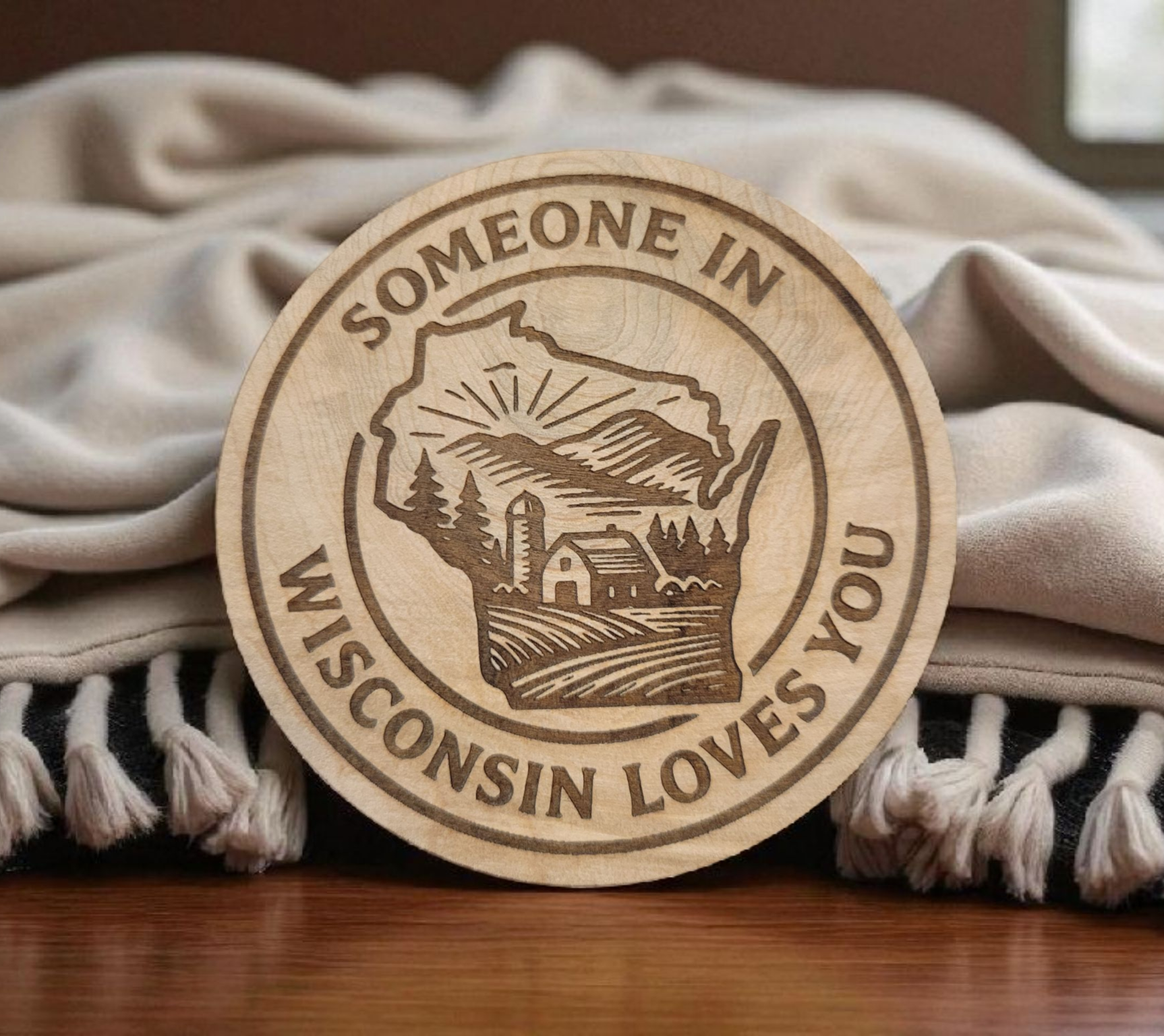 Engraved wood magnet in shape of Wisconsin with “Someone in Wisconsin Loves You” design.