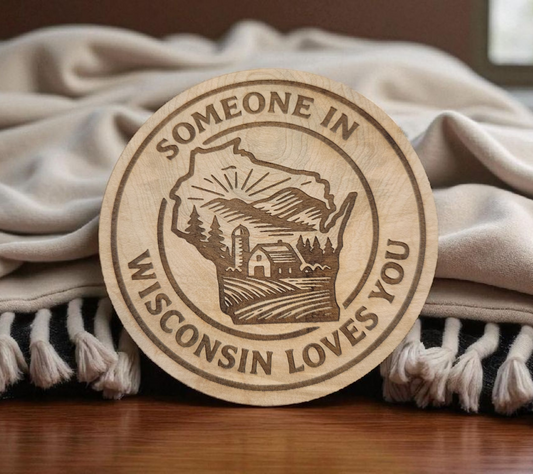 Engraved wood magnet in shape of Wisconsin with “Someone in Wisconsin Loves You” design.