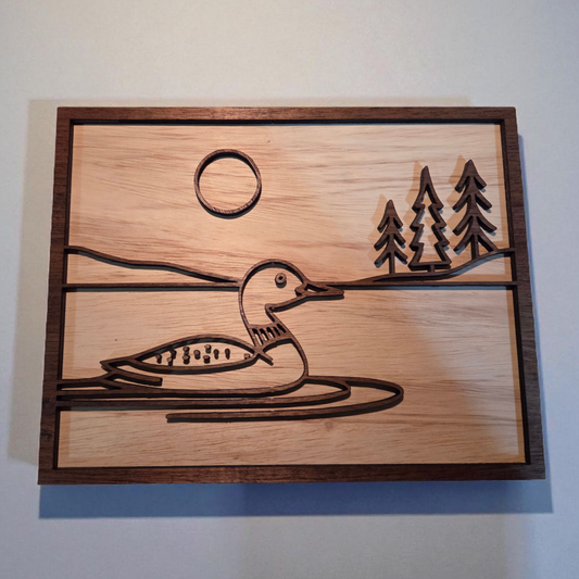 Layered wood loon lake sign with moon and pine trees