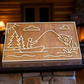 Layered maple wood sign featuring North Woods fishing scene