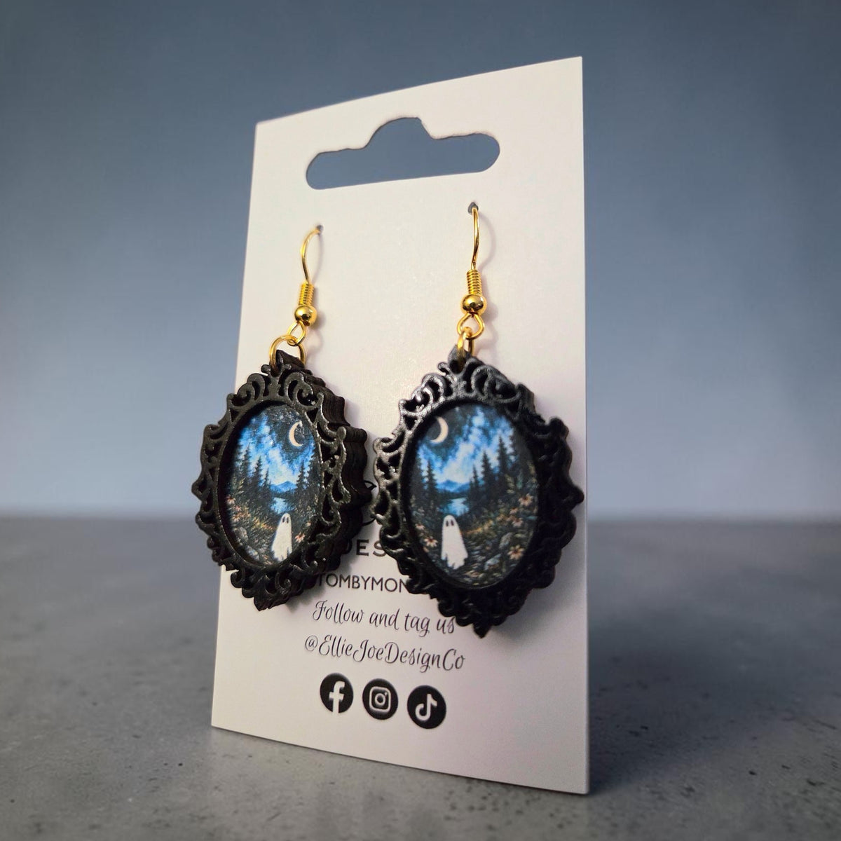 Ghost dangle earrings with original Ellie Joe Design Co. moonlit forest artwork and ornate black frames