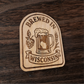 Laser-engraved wood magnet with beer mug, hops, and wheat, reading “Brewed in Wisconsin”