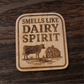 Laser-engraved wood magnet with cow and barn design, captioned “Smells Like Dairy Spirit”